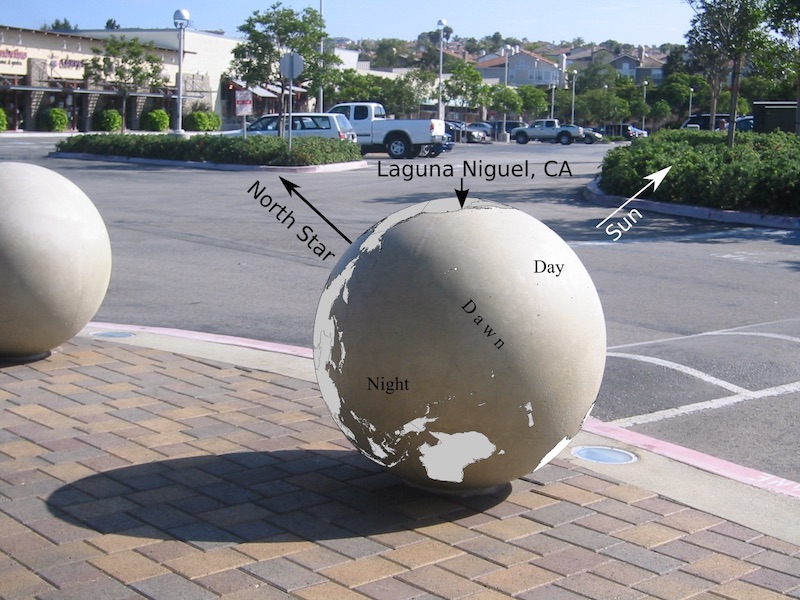 A spherical concrete bollard, re-envisioned as a globe sundial