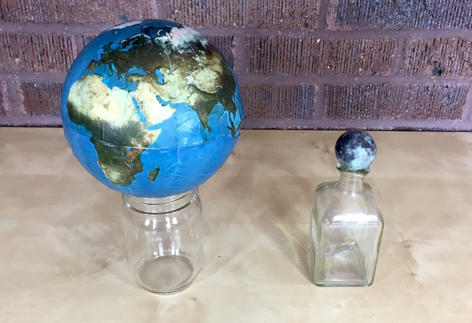 Homemade globes of the earth and moon to scale