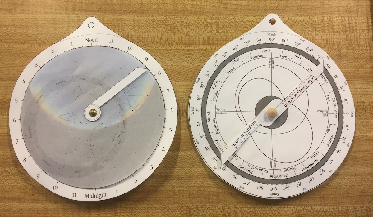 The front and back sides of an educational astrolabe, assembled from cut-out paper parts