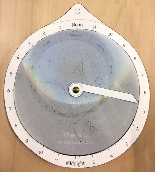 An educational paper astrolabe, set to the time of sunrise in April
