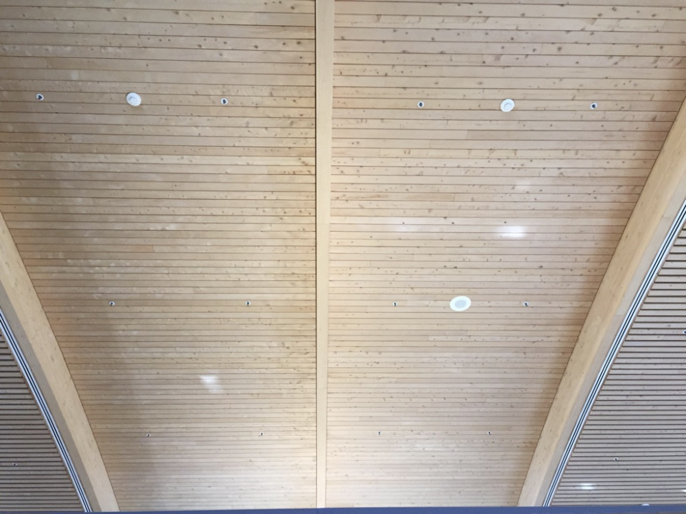 Curved ceiling rafters can appear curved or straight, depending on perspective, as illustrated by the rafters of the Mission Viejo Public Library