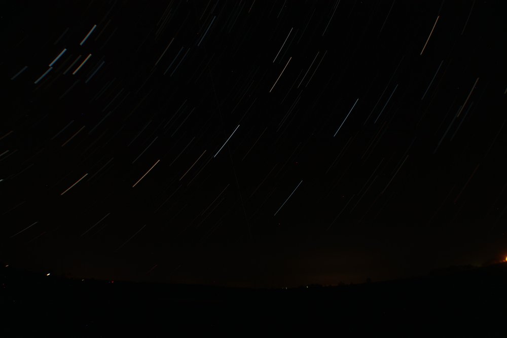 A time-lapse, star-trail photo of Cassiopeia and the Great Square